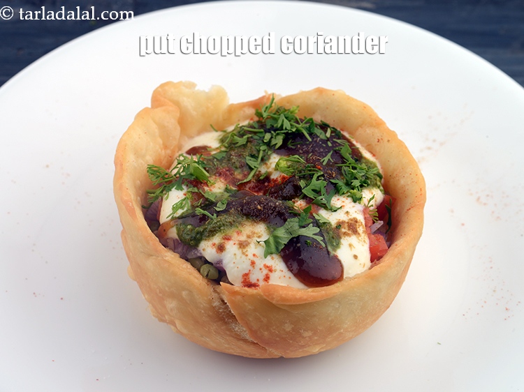 Step 33 – Finally put 1 tsp&nbsp;<a href="https://www.tarladalal.com/glossary-chopped-coriander-783i">chopped coriander (dhania)</a>.