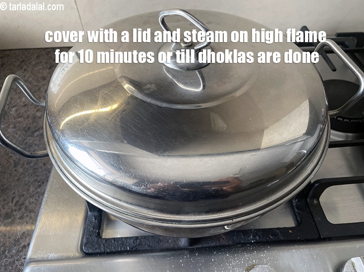Step 31 – <meta charset="UTF-8" /> Cover with a lid and steam the dhoklas on a high flame …