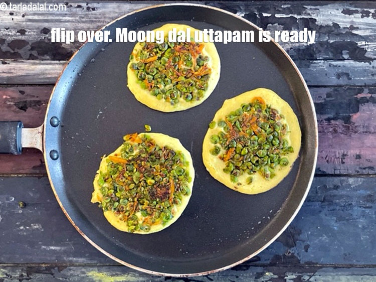 Step 40 – Flip over. <strong>Moong dal uttapam</strong> is ready.&nbsp;Repeat with the remaining mixture and stuffing to make …
