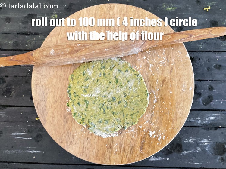 Step 39 – Roll out a portion into a 100 mm. (4&rdquo;) diameter thick circle, using a little …