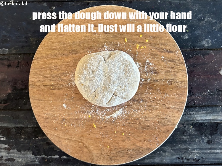 Step 41 – Press the dough down with your hand to flatten it. Dust with a little flour.