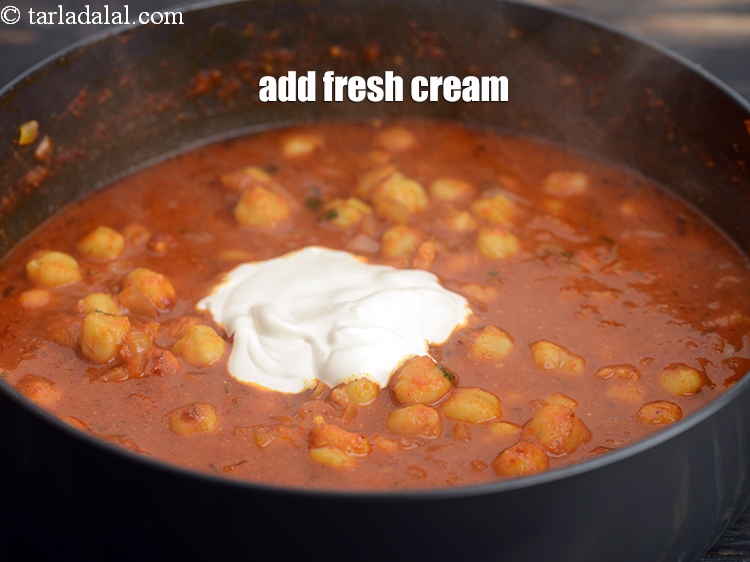 Step 32 – Add 2 tbsp <a href="https://tarladalal.com/glossary-fresh-cream-1877i">fresh cream</a>.
