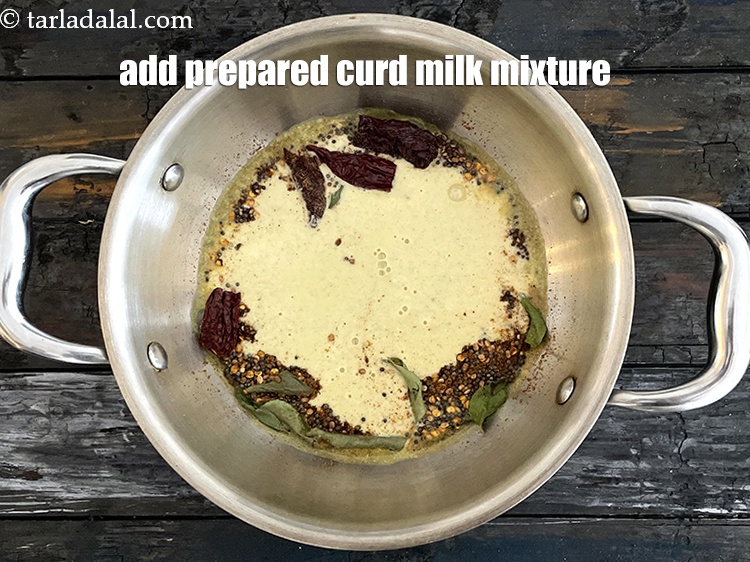 Step 31 – Add the prepared curds-milk mixture.