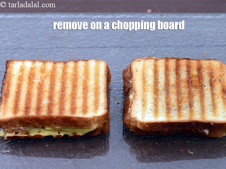 Step 30 – Remove&nbsp;<strong>rajma and cheese sandwich</strong>&nbsp;on a chopping board.