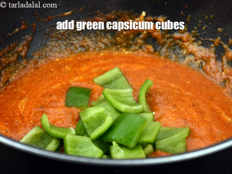 Step 32 – Add &frac34; cup green&nbsp;<a href="https://www.tarladalal.com/glossary-capsicum-cubes-170i">capsicum cubes</a>.