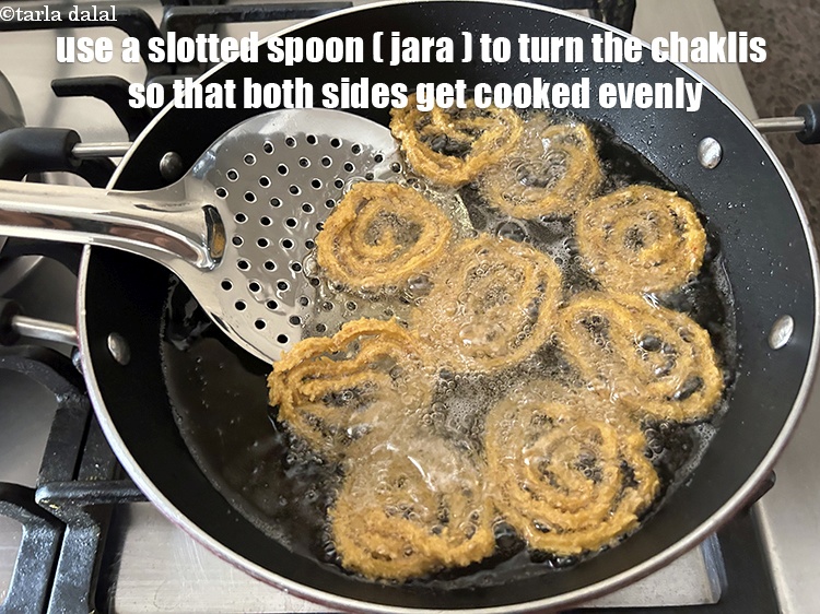 Step 33 – Use a slotted spoon to turn the chaklis over so that they fry evenly on …