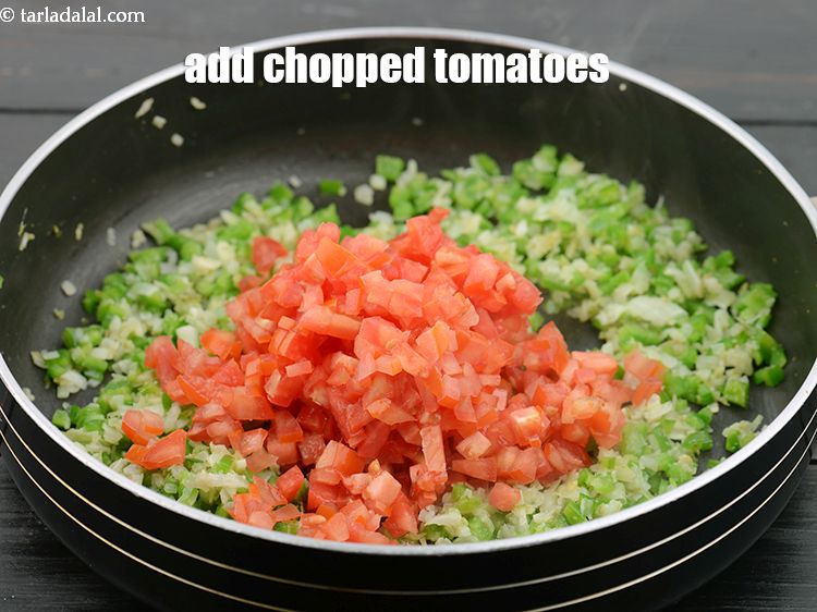 Step 32 – Add 1 cup&nbsp;finely&nbsp;<a href="https://www.tarladalal.com/glossary-chopped-tomatoes-779i">chopped tomatoes</a>.&nbsp;