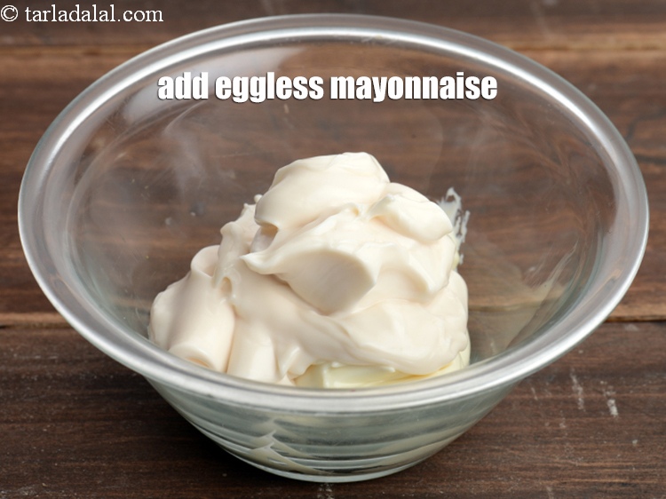 Step 4 – Add &frac14; cup <a href="https://tarladalal.com/glossary-eggless-mayonnaise-1995i">eggless mayonnaise</a>.