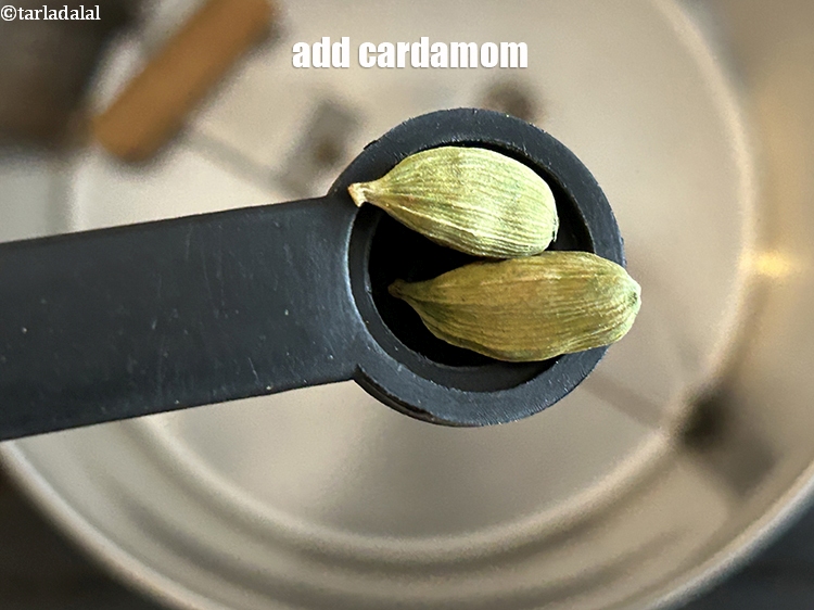 Step 12 – Add&nbsp;<meta charset="UTF-8" />2&nbsp;<a href="glossary-cardamom-elaichi-262i">cardamoms</a>.
