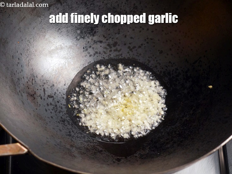 Step 4 – Add 2 tsp finely <a href="https://www.tarladalal.com/glossary-chopped-garlic-790i">chopped garlic (lehsun)</a>.