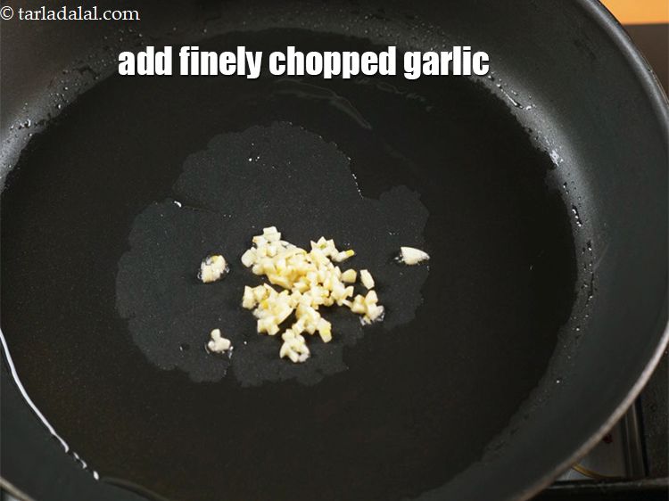 Step 5 – Add 1 tsp finely <a href="https://www.tarladalal.com/glossary-chopped-garlic-790i">chopped garlic (lehsun)</a>.