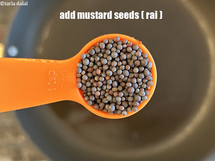 Step 11 – Add&nbsp;<meta charset="UTF-8" />1 1/2 tsp&nbsp;<a href="glossary-mustard-seeds-sarson-rai-sarson-ke-beej-525i">mustard seeds ( rai / sarson)</a>.