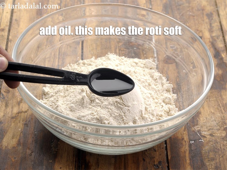 Step 11 – Add&nbsp;1 tbsp&nbsp;oil.&nbsp;This makes the roti soft.