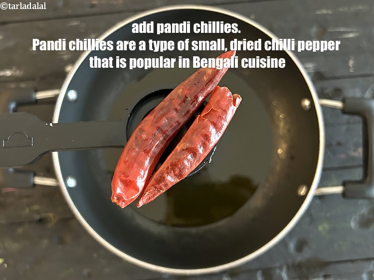 Step 6 – Add 2 dry p<meta charset="UTF-8" />dry&nbsp;<a href="glossary-pandi-chillies-pandi-dry-red-chillies-2373i">pandi chilli</a>.&nbsp;<a href="https://www.tarladalal.com/recipes-using-pandi-chillies-pandi-dry-red-chillies-2373">Pandi chilies</a> are a type of small, …