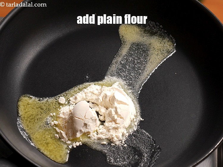 Step 4 – Add 1 tbsp <a href="https://www.tarladalal.com/glossary-plain-flour-maida-188i">plain flour (maida)</a>.