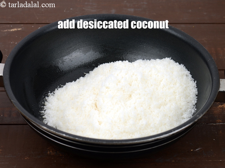Step 5 – Add 3 cups <a href="https://www.tarladalal.com/glossary-desiccated-coconut-272i">desiccated coconut</a>. It is easily available in the local market.