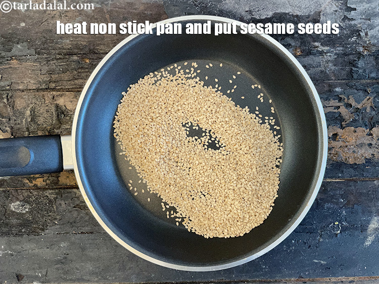 स्टेप 8 – तिल भूनने के लिए, एक नॉन-स्टिक पैन गरम करें और …