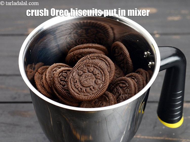 Step 4 – Crush 42 <a href="https://www.tarladalal.com/glossary-oreo-biscuits-oreo-cookies-1223i">oreo biscuits</a>&nbsp;that is 3 packets and put it in the mixer.