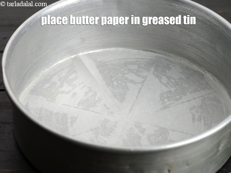 Step 6 – Place the butter paper in the greased tin.