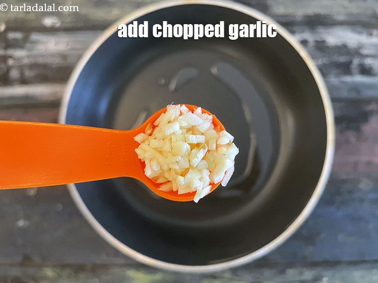 Step 9 – Add&nbsp;<meta charset="UTF-8" />1 tsp&nbsp;finely&nbsp;<a href="glossary-chopped-garlic-790i">chopped garlic (lehsun)</a>.