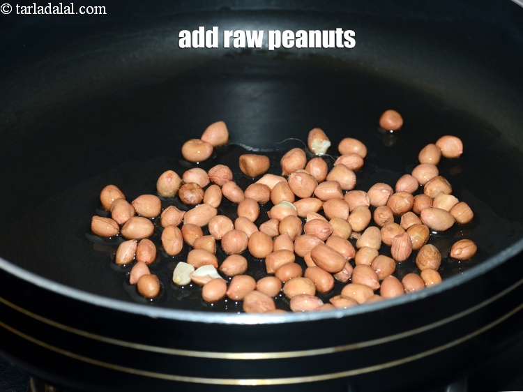 Step 4 – Add &frac12; cup <a href="https://www.tarladalal.com/glossary-raw-peanuts-kachi-mungfali-kachi-moongfali-847i">raw peanuts</a>.