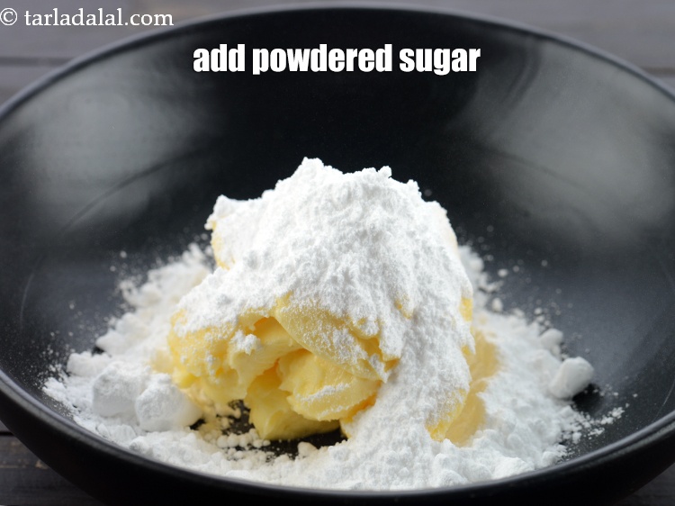 Step 4 – Add &frac12; cup <a href="https://www.tarladalal.com/glossary-powdered-sugar-280i">powdered sugar</a>.