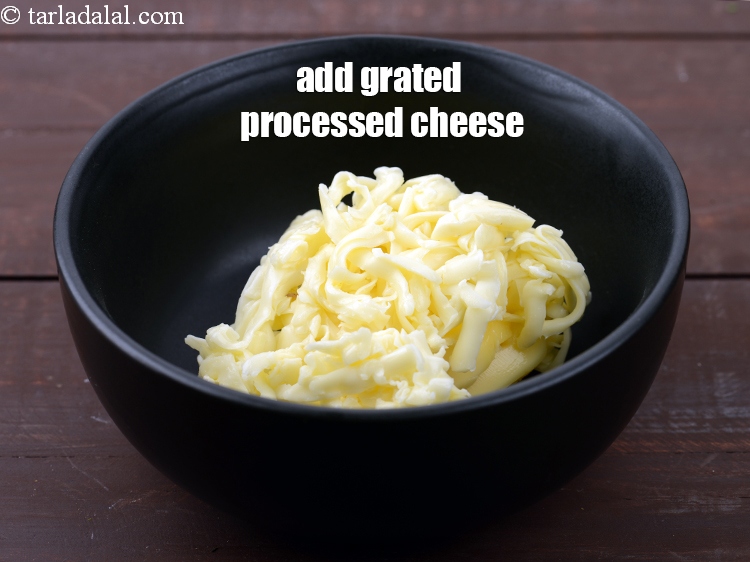 Step 4 – Add &frac12; cup <a href="https://tarladalal.com/glossary-grated-processed-cheese-868i">grated processed cheese</a>.