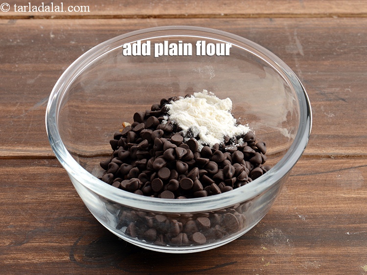 Step 4 – Add &frac12; tsp <a href="https://www.tarladalal.com/glossary-plain-flour-maida-188i">plain flour (maida)</a>.