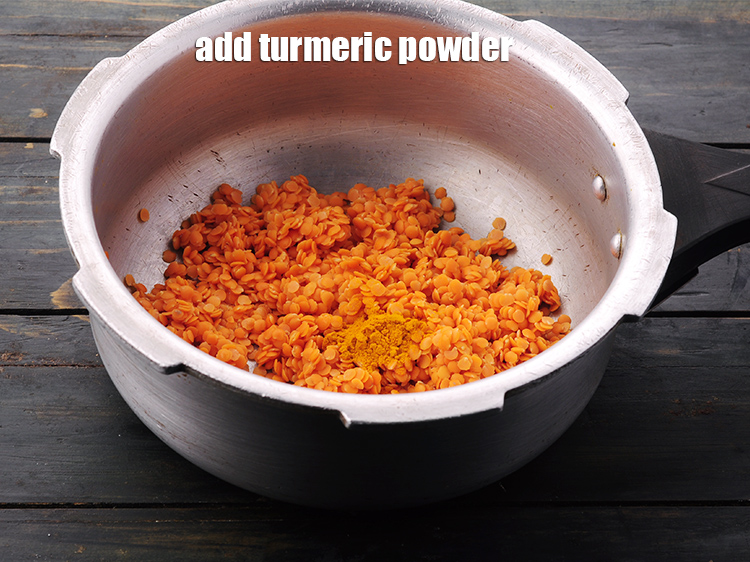 Step 10 – Add the <a href="https://www.tarladalal.com/glossary-turmeric-powder-haldi-645i" target="_blank">turmeric powder</a>.