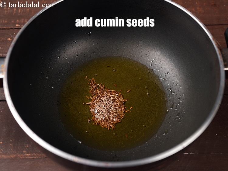 Step 5 – Add 1 tsp <a href="http://cumin seeds (jeera)" target="_blank">cumin seeds</a>.