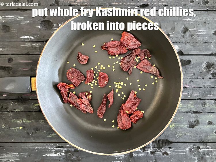 Step 4 – Put&nbsp;<meta charset="UTF-8" />10&nbsp;<a href="glossary-whole-dry-kashmiri-red-chillies-kashmiri-mirch-kashmiri-lal-mirch-332i">whole dry kashmiri red chillies</a>&nbsp;, broken into pieces.