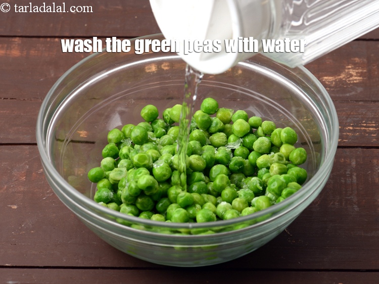Step 14 – Wash the green peas with water.