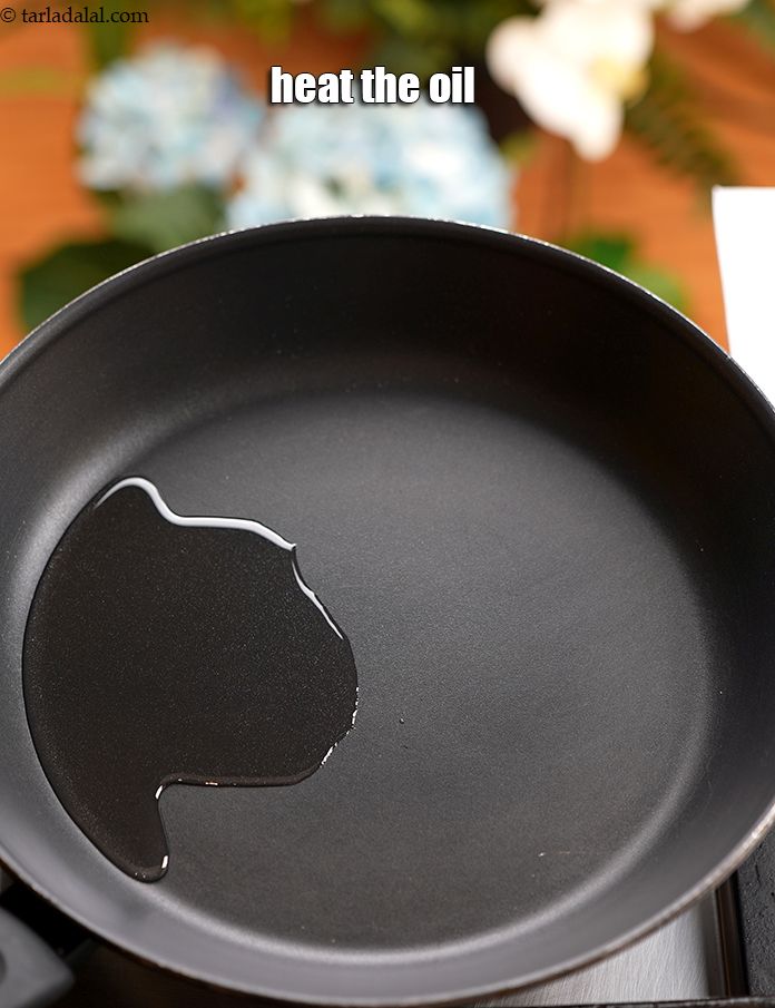 Step 2 – For making the <strong>poha chivda recipe</strong>, in the same pan, heat 3 tbsp&nbsp;<a href="https://www.tarladalal.com/glossary-oil-671i">oil</a>.&nbsp;