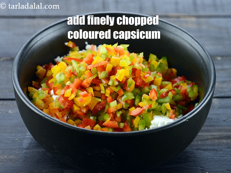 Step 4 – Add 1/2 cup finely chopped coloured <a href="https://www.tarladalal.com/glossary-capsicum-shimla-mirch-bell-pepper-163i">capsicum</a> (red , yellow and green).