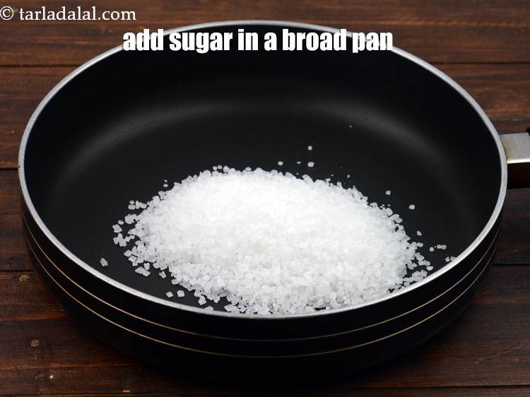 Step 4 – Add &frac12; cup <a href="https://www.tarladalal.com/glossary-sugar-chini-shakkar-278i">sugar</a> in a broad pan.
