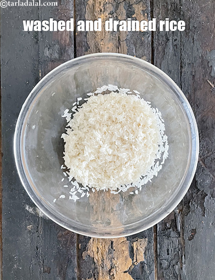 Step 9 – Keep the <strong>washed and drained rice </strong>in a bowl.
