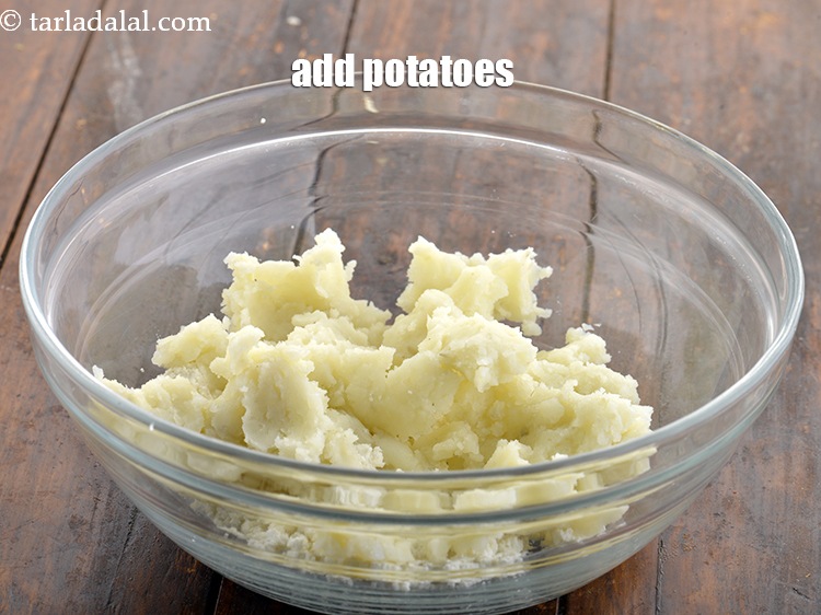 Step 2 – Add the potatoes to the bowl. We have boiled them in a pressure cooker, peeled …