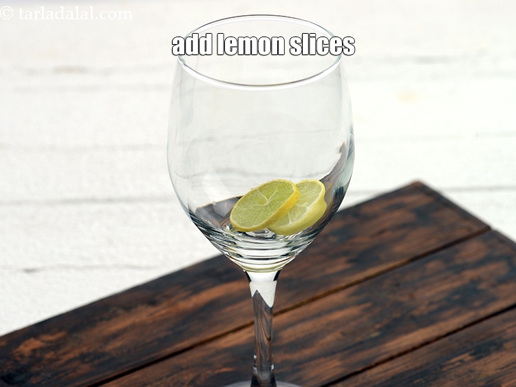 Step 4 – &nbsp;Add 2&nbsp;<a href="https://www.tarladalal.com/glossary-lemon-slices-758i">lemon slices</a>.
