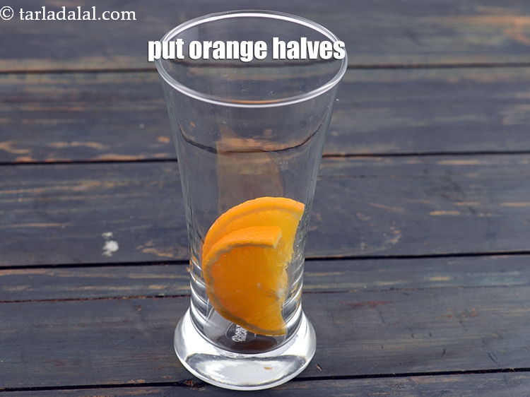 Step 4 – Put 2&nbsp;big&nbsp;<a href="https://www.tarladalal.com/glossary-orange-narangi-santra-114i">oranges</a>&nbsp;slices , cut into halves.