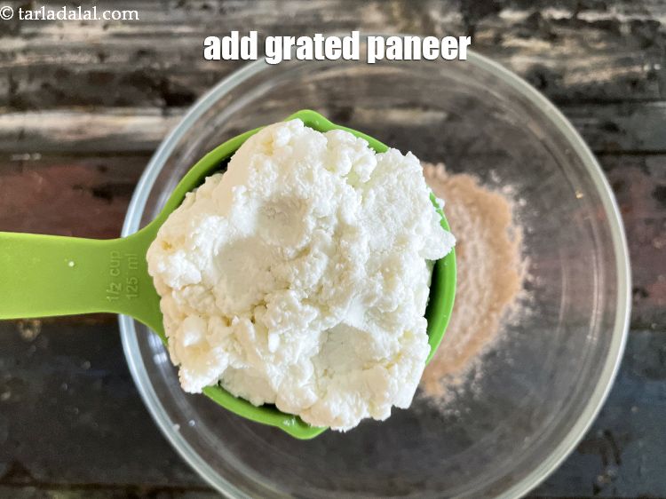 Step 6 – Add&nbsp;<meta charset="UTF-8" />1/2 cup&nbsp;<a href="glossary-grated-low-fat-paneer-1118i">grated low-fat paneer (cottage cheese)</a>.&nbsp;