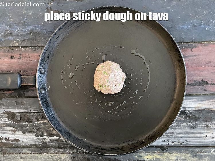 Step 17 – Place the dough ball on the hot tava.