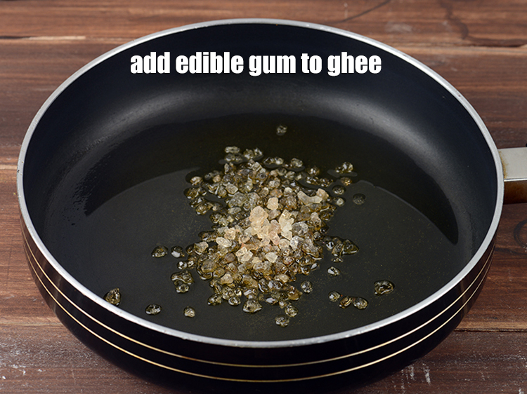 Step 4 – Add 2 tbsp <a href="https://www.tarladalal.com/glossary-edible-gum-gond-465i">edible gum (gond)</a> to the ghee.