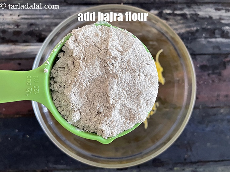 Step 7 – Add&nbsp;<meta charset="UTF-8" />1/2 cup&nbsp;<a href="glossary-bajra-flour-bajra-ka-atta-bajre-ka-atta-176i">bajra (black millet) flour</a>.