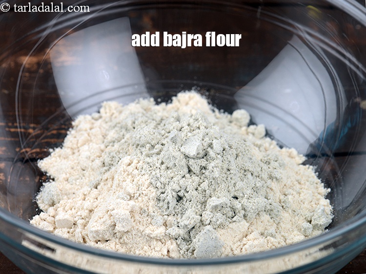 Step 4 – Add&nbsp;2 tbsp&nbsp;<a href="https://www.tarladalal.com/glossary-bajra-flour-bajra-ka-atta-bajre-ka-atta-176i">bajra (black millet) flour</a>.&nbsp;