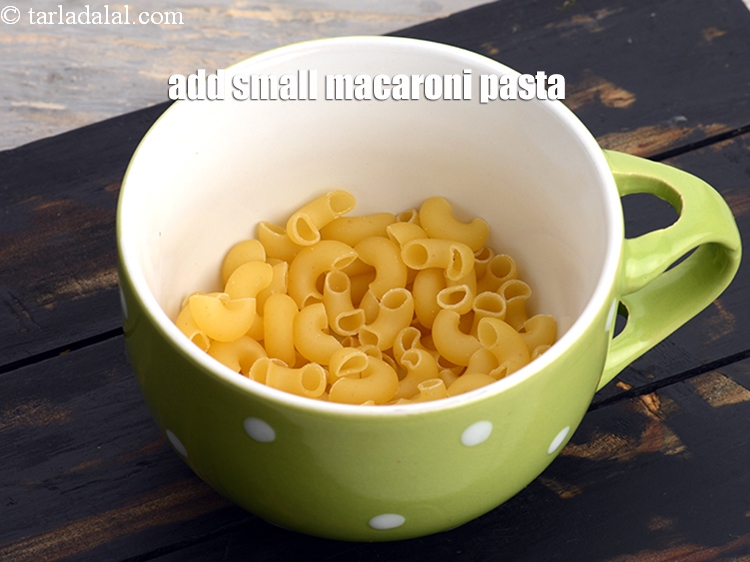 Step 4 – Add 5 tbsp of small <a href="https://www.tarladalal.com/glossary-macaroni-elbow-shaped-pasta-575i">macaroni</a>&nbsp;<a href="https://www.tarladalal.com/glossary-pasta-570i">pasta</a>.