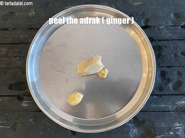 Step 6 – Peel the adrak.