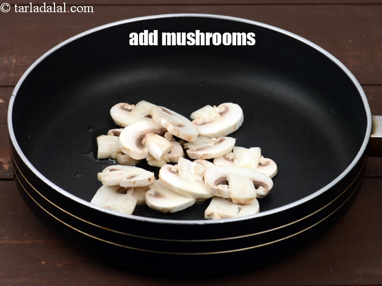 Step 12 – Add 1/2 cup&nbsp;<a href="https://www.tarladalal.com/glossary-sliced-mushrooms-747i">sliced mushrooms (khumbh)</a>.
