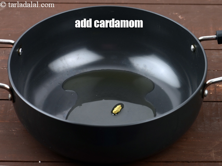 Step 5 – Add 1 <a href="https://www.tarladalal.com/glossary-cardamom-elaichi-262i">cardamom (elaichi)</a>.