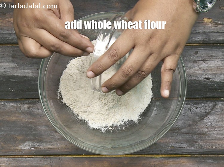 Step 5 – Add 1/2 cup&nbsp;<a href="https://www.tarladalal.com/glossary-whole-wheat-flour-gehun-ka-atta-gehun-ka-aata-429i">whole wheat flour (gehun ka atta)</a>.