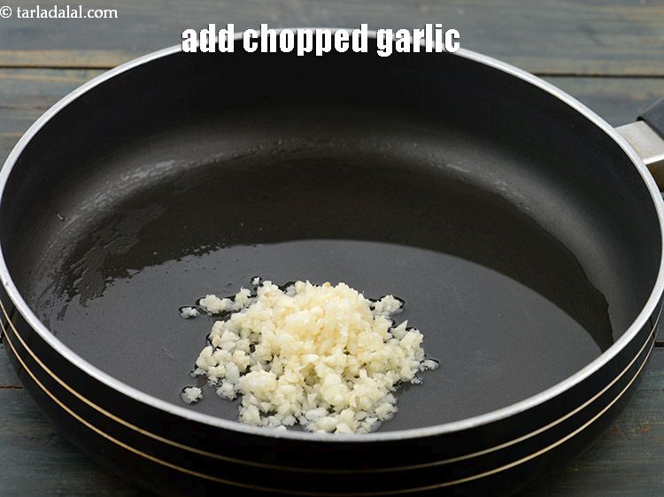 Step 14 – Add 2 tbsp&nbsp;finely&nbsp;<a href="https://www.tarladalal.com/glossary-chopped-garlic-790i">chopped garlic (lehsun)</a>.&nbsp;